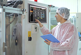 Stainless steel HMI panel PC in industry operated by worker